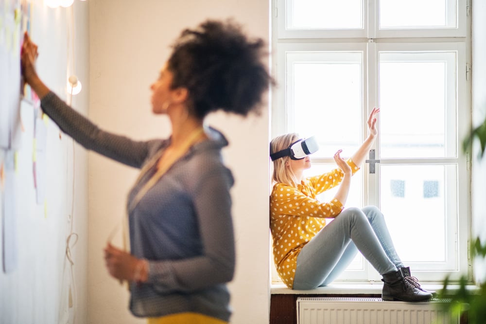 young-creative-women-with-vr-goggles-in-studio-sta-PKXLH67